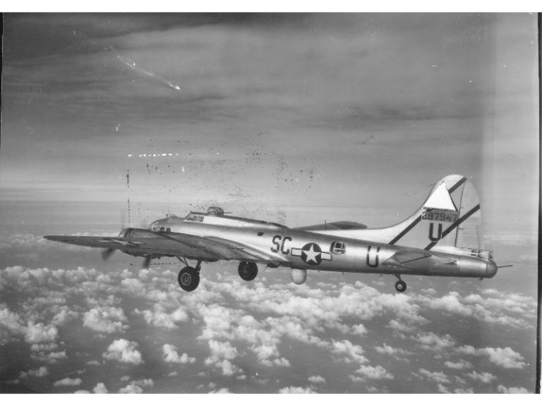 Radar-equipped Mickey plane flying over clouds